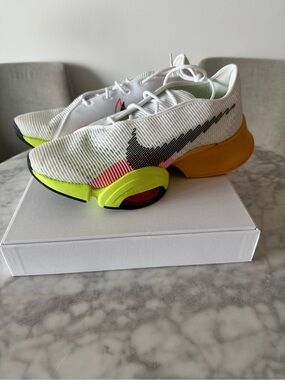 Nike White Training Shoes with Neon Yellow, Orange & Black Accents